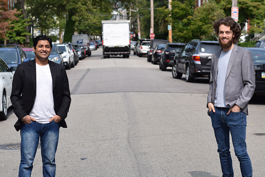 MSE students Vivek Gupta and Daniel Biales standing in a street.